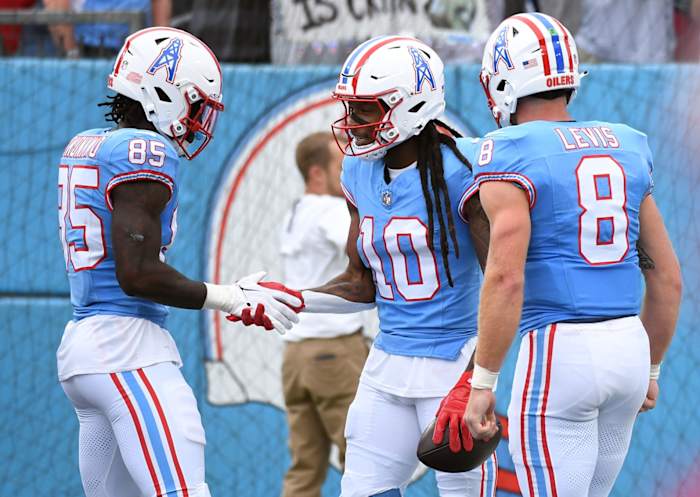 Tennessee Titans wide receiver DeAndre Hopkins (10) celebrates with tight end Chigoziem Okonkwo (85) and quarterback Will Levis (8) after a touchdown during the first half against the Atlanta Falcons at Nissan Stadium.